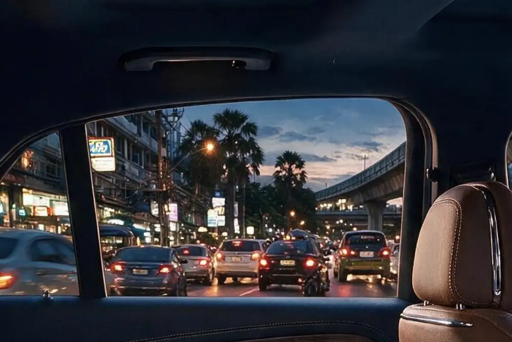 bangkok street traffic at night viewed through a car window