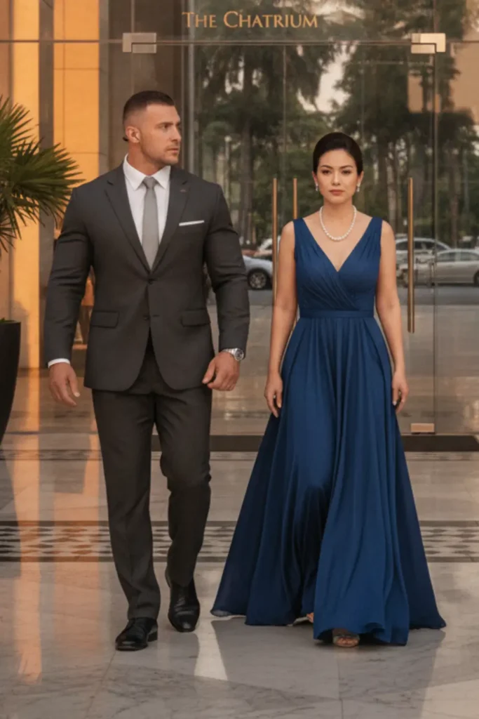close protection officer dresses in suite with business woman out of the hotel