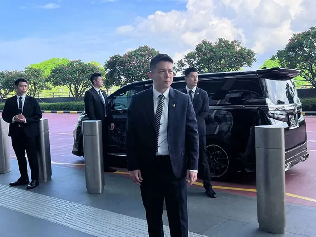 close protection team securing vip arrival with luxury van in thailand