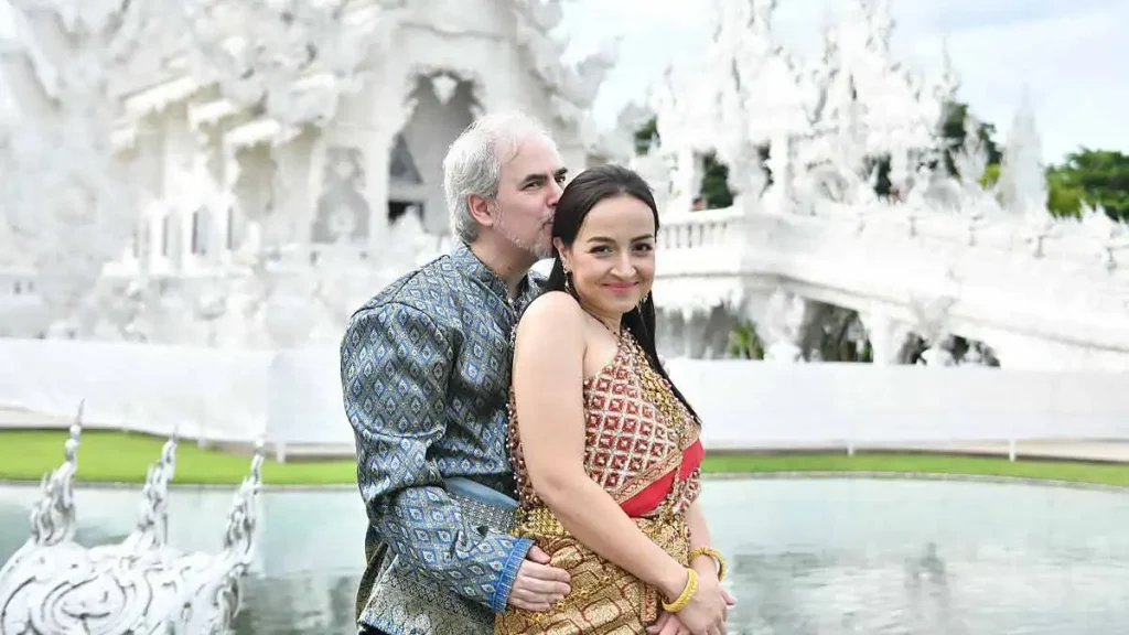 couple in traditional thai dress at temple in chiang rai