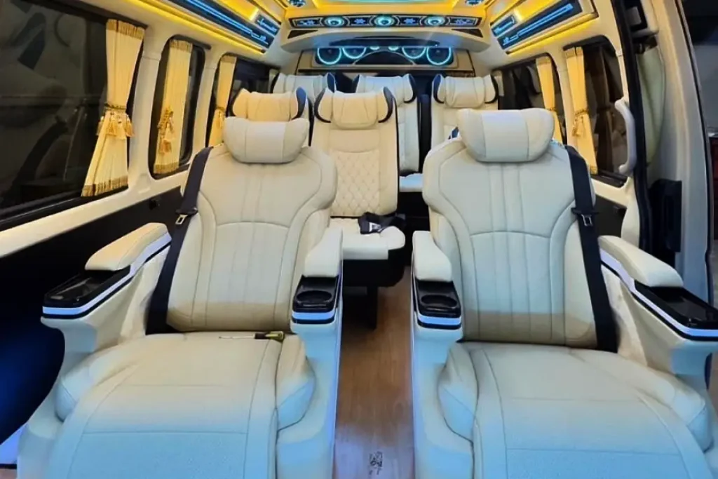 Luxury VIP van interior with white leather captain seats for private transportation in Bangkok