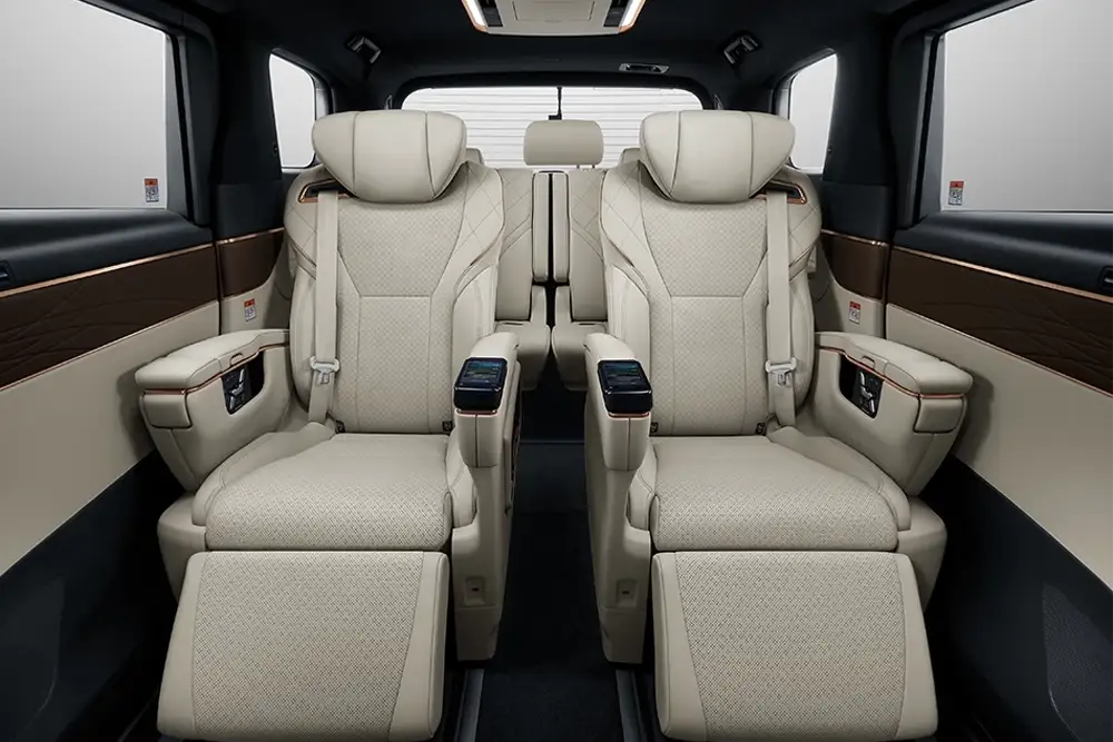 premium leather captain seats inside a luxury van used for bangkok group transport