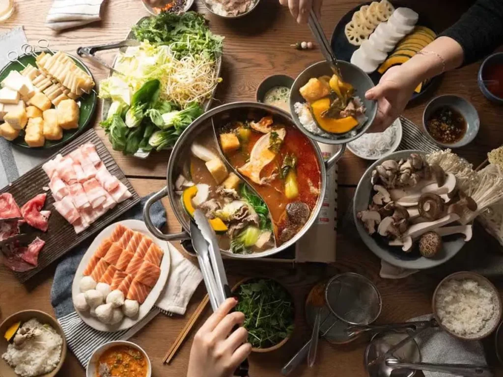 shared thai hot pot meal during a guided food tour in bangkok