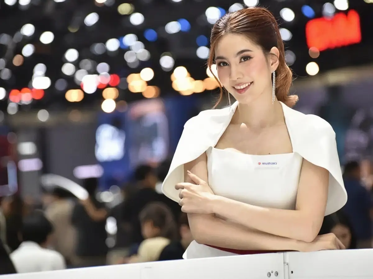 thai event hostess in white uniform at a bangkok motor show exhibition