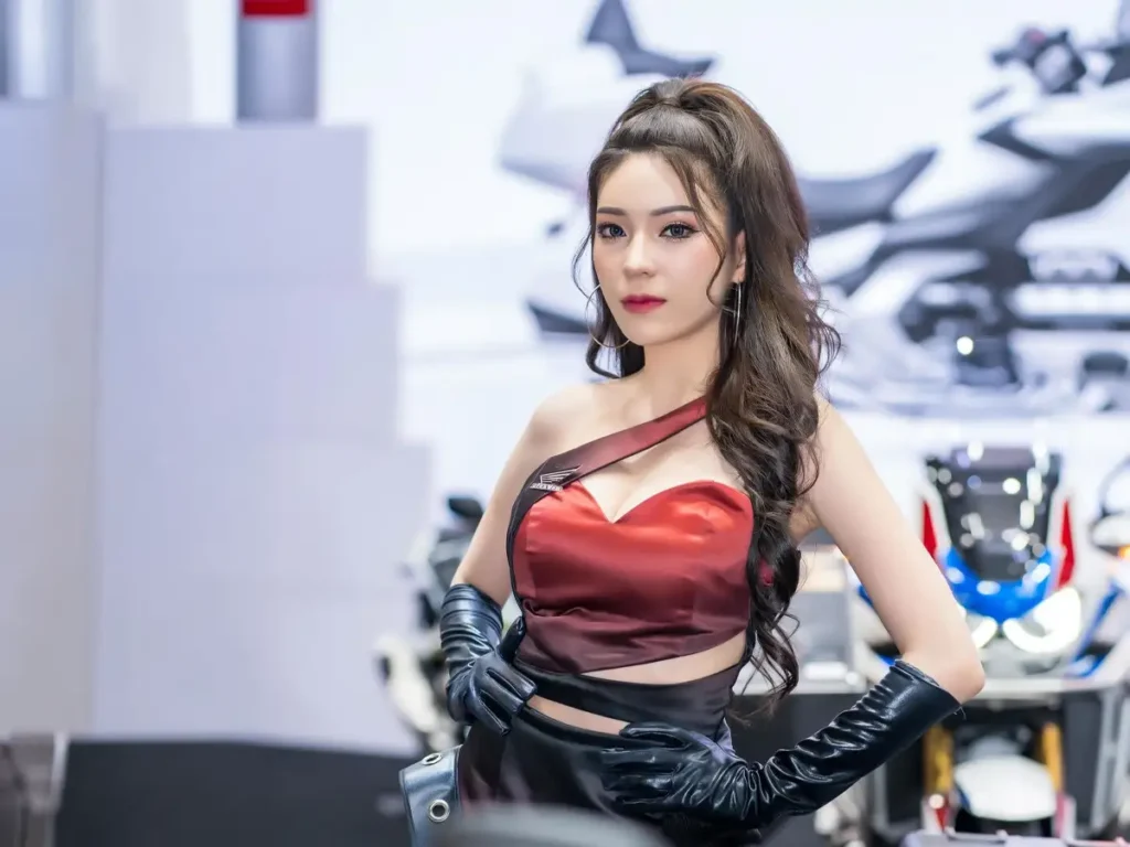 thai event model representing a motorsport brand at a bangkok exhibition